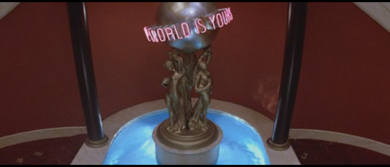 the world is yours statue. the world is yours blimp. the